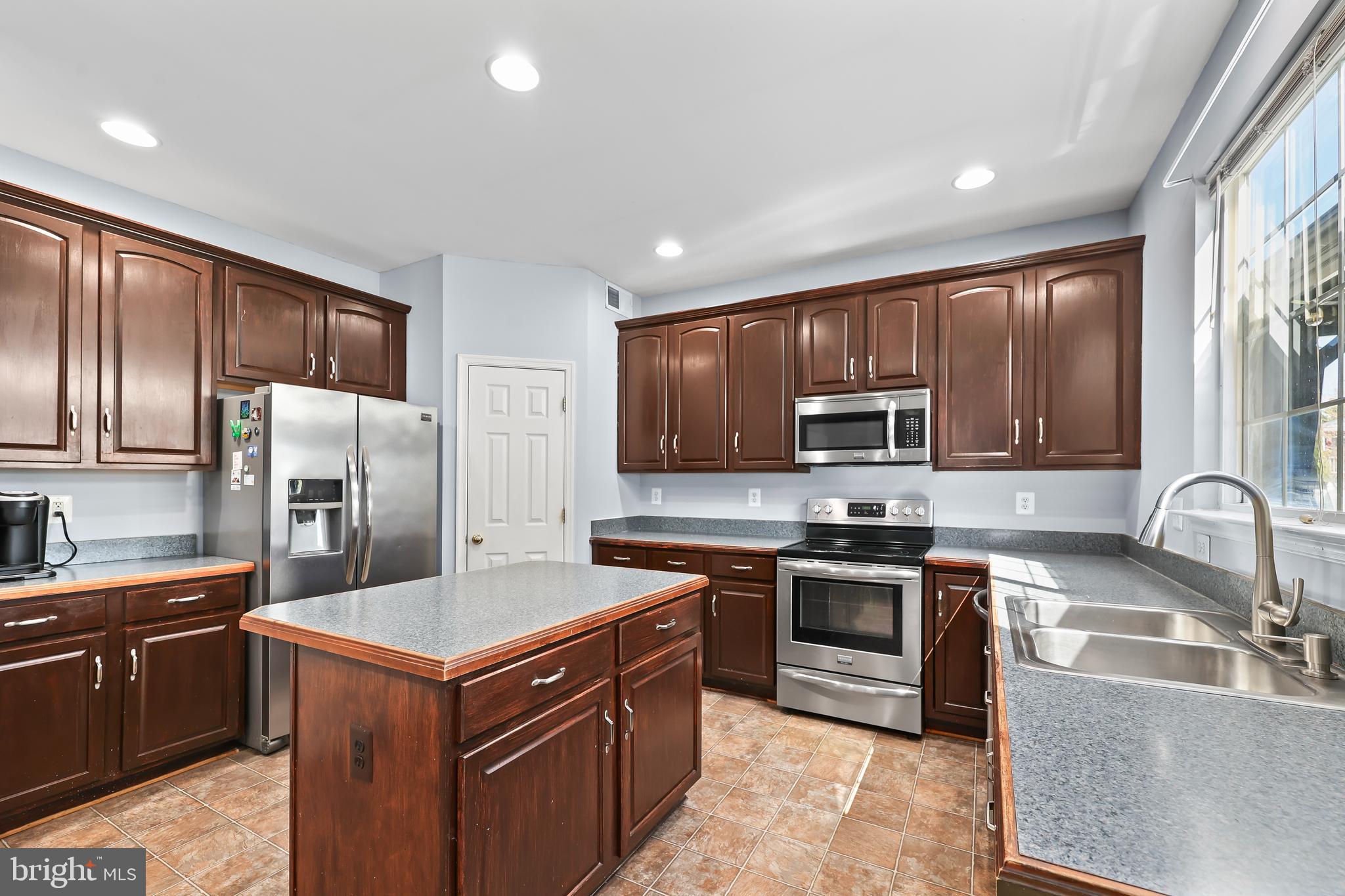44 Hamstead Road Fredericksburg, VA 22405 - Photo 11 of 53 a kitchen with stainless steel appliances granite countertop a stove top oven a sink refrigerator and cabinets