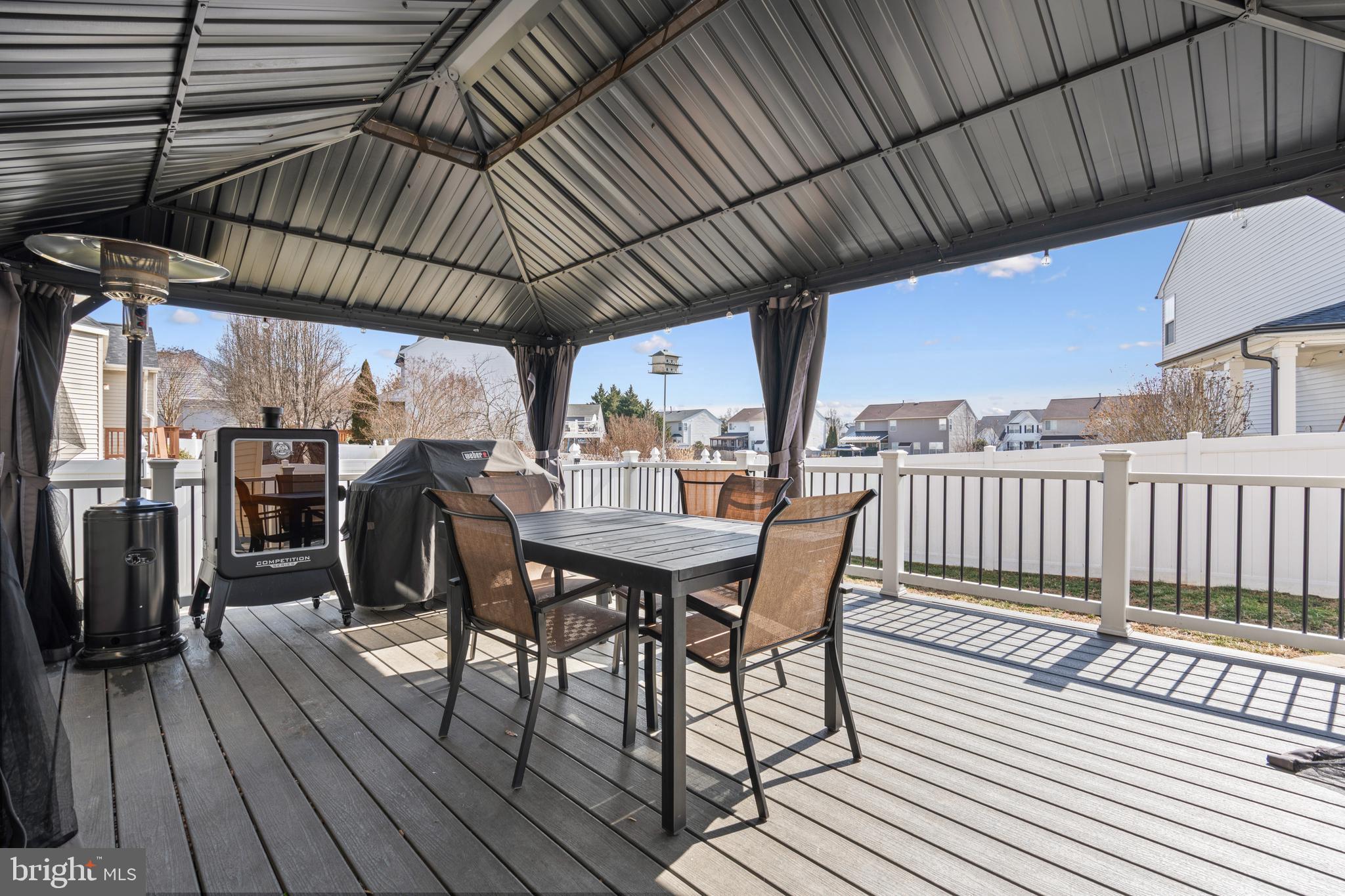 44 Hamstead Road Fredericksburg, VA 22405 - Photo 16 of 53 a view of a chairs and table on the wooden roof deck