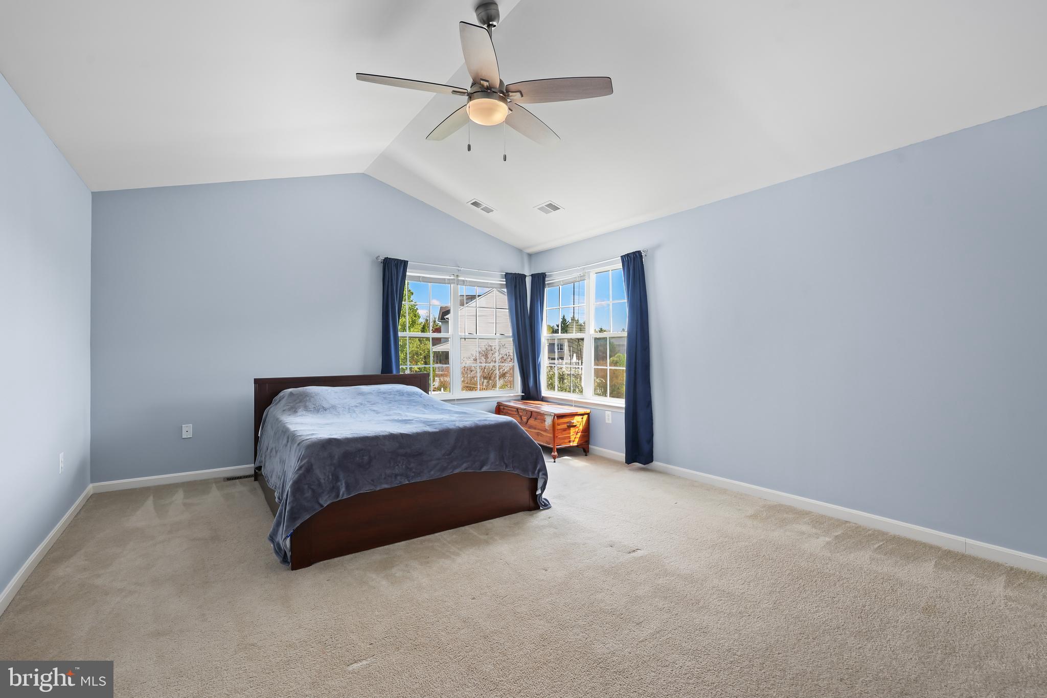 44 Hamstead Road Fredericksburg, VA 22405 - Photo 27 of 53 a spacious bedroom with a large bed chandelier and a window