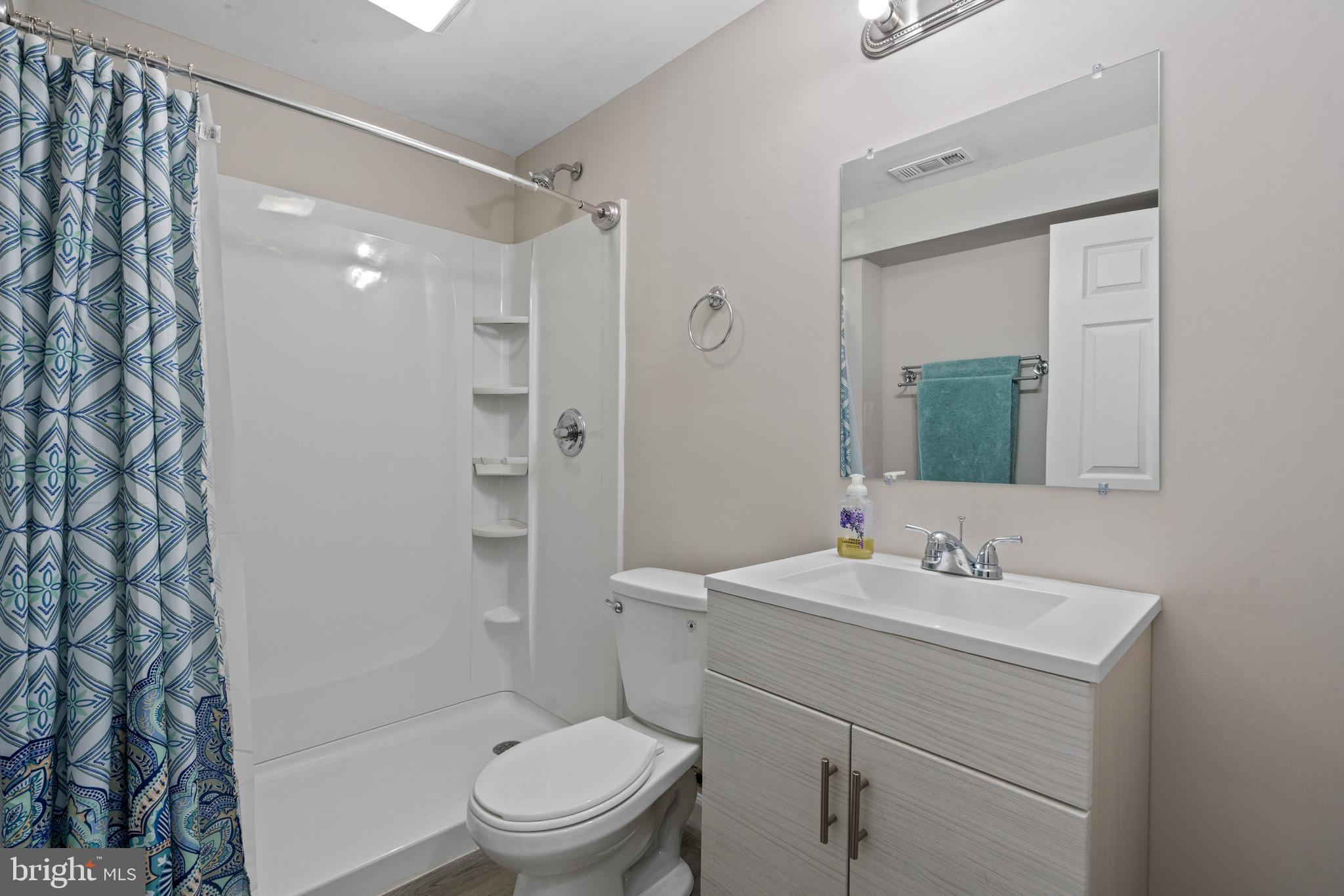 44 Hamstead Road Fredericksburg, VA 22405 - Photo 44 of 53 a bathroom with a sink toilet and shower