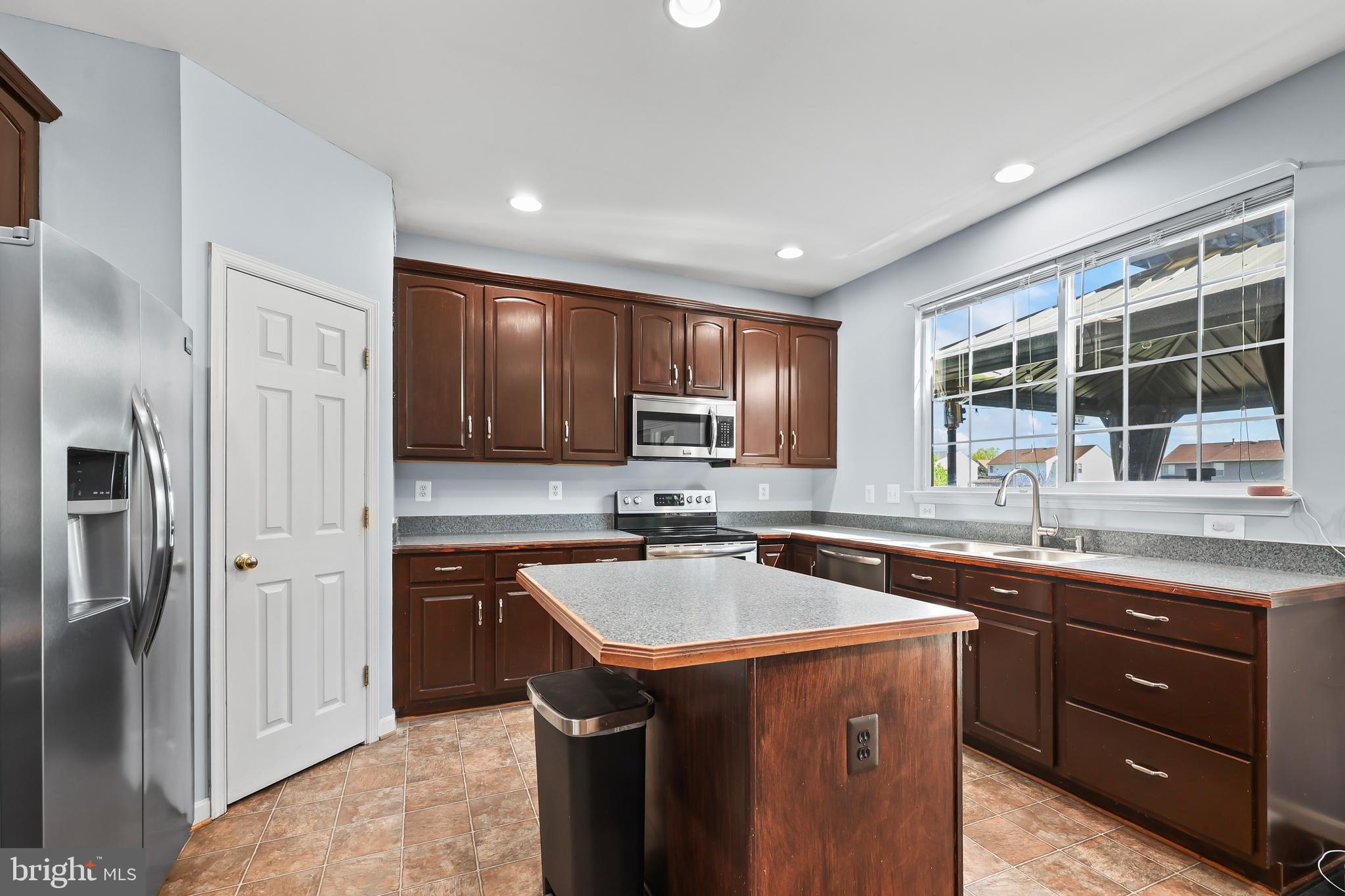 44 Hamstead Road Fredericksburg, VA 22405 - Photo 10 of 53 a kitchen with a sink stove and refrigerator