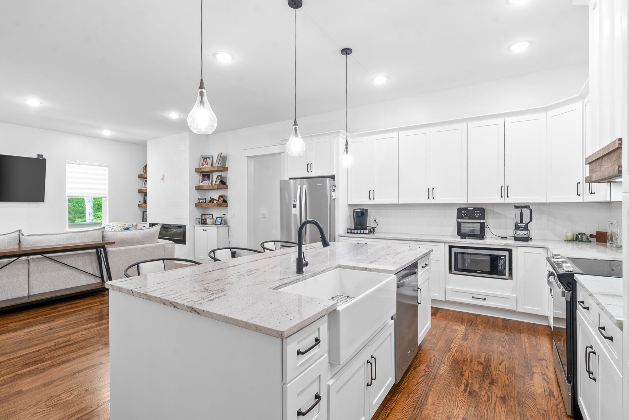 514 Doy Road White Bluff, TN 37187 - Photo 18 of 57 a kitchen with stainless steel appliances granite countertop a sink a stove and a wooden floors