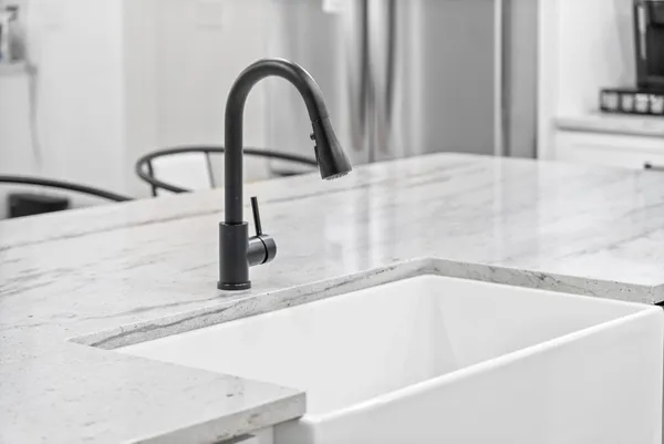 a bedroom with a bed window and a mirror