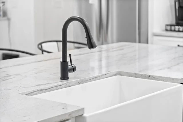 a bedroom with a bed window and a mirror