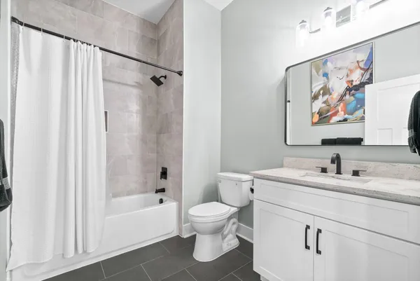 a bathroom with a sink vanity and mirror