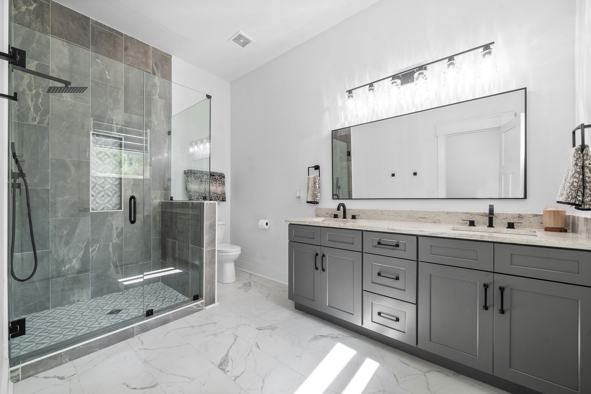 514 Doy Road White Bluff, TN 37187 - Photo 26 of 57 a bathroom with a double vanity sink mirror and shower