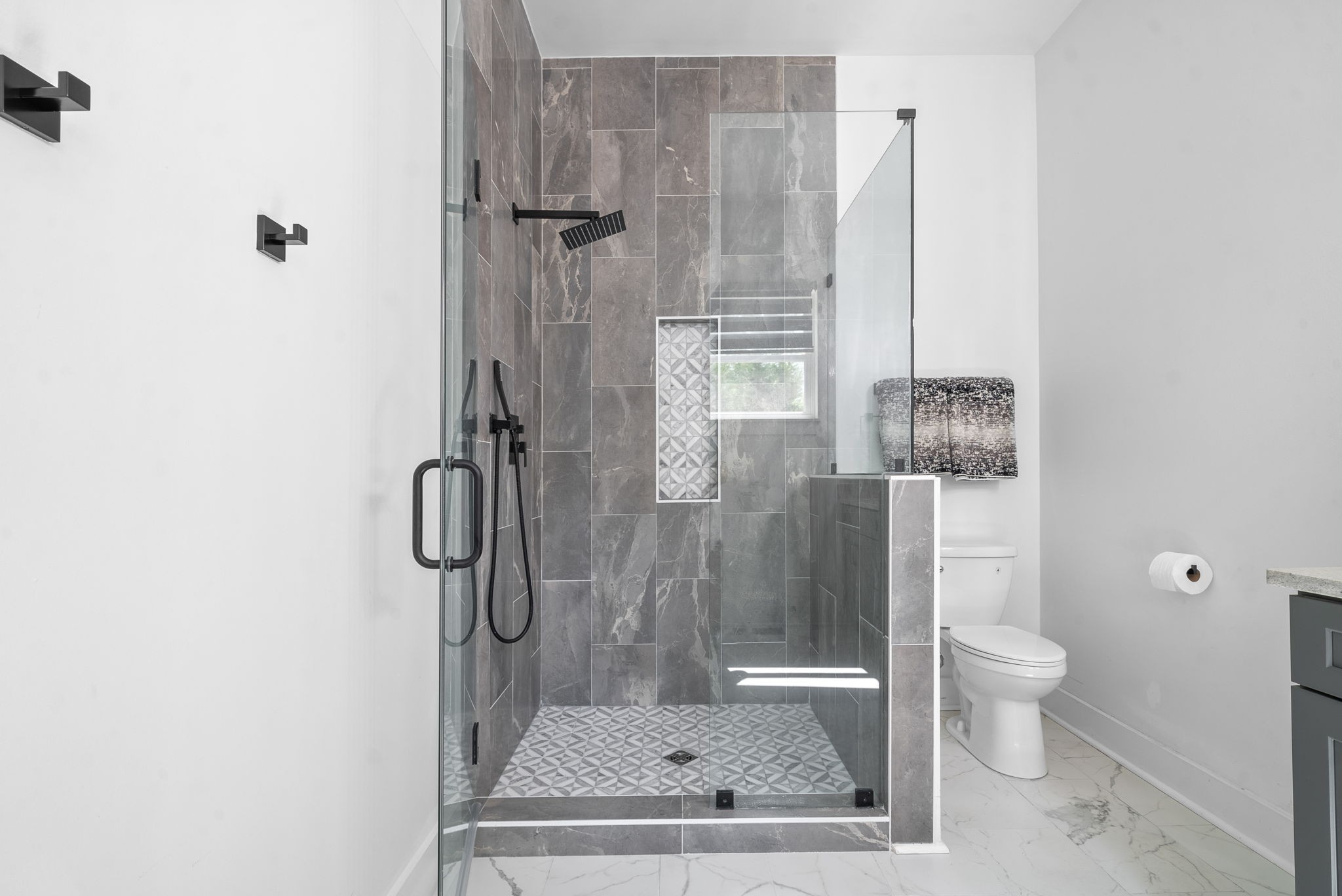 514 Doy Road White Bluff, TN 37187 - Photo 29 of 57 a bathroom with a granite countertop shower a toilet and a sink