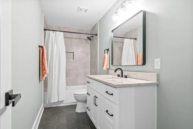 a view of a patio with table and chairs a barbeque with potted plants and large tree