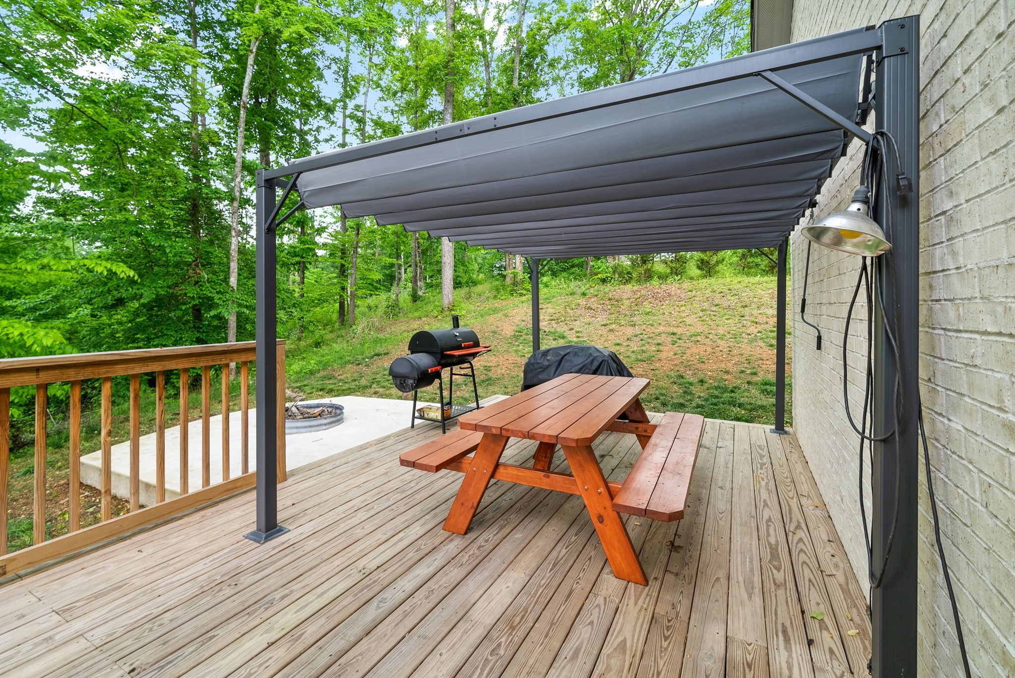514 Doy Road White Bluff, TN 37187 - Photo 39 of 57 a view of balcony with wooden floor and outdoor seating