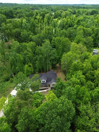 a aerial view of a house with a yard