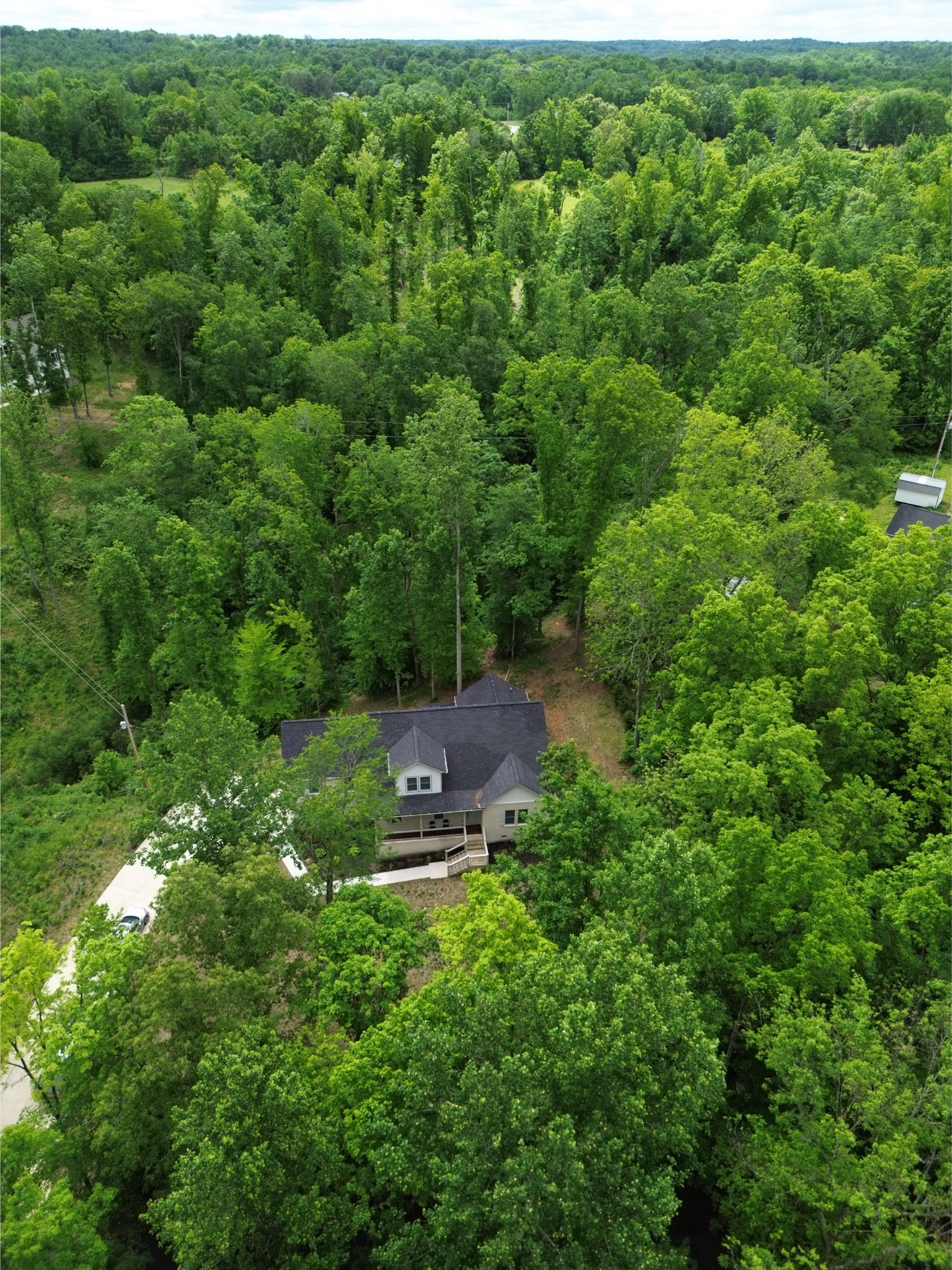 514 Doy Road White Bluff, TN 37187 - Photo 44 of 57 an aerial view of residential house with outdoor space and trees all around
