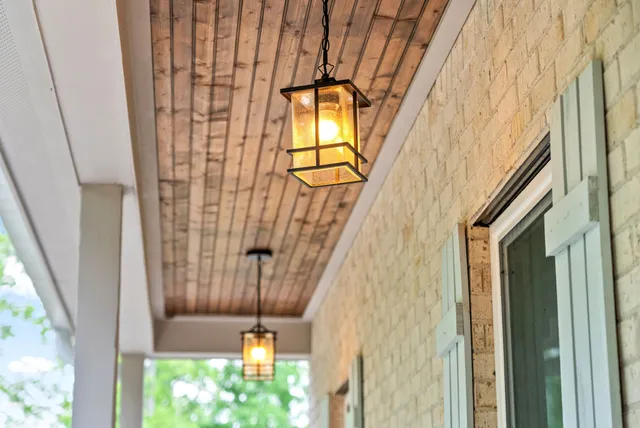 a living room with furniture and a book shelf
