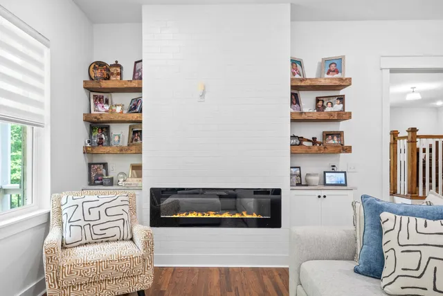 a kitchen with stainless steel appliances kitchen island granite countertop a dining table chairs and sink