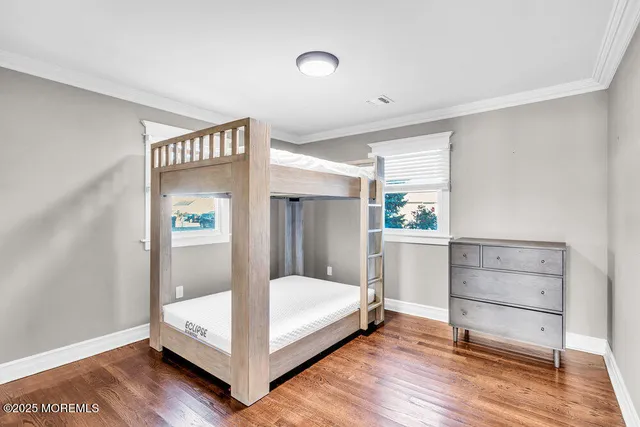 a view of bedroom with furniture and window