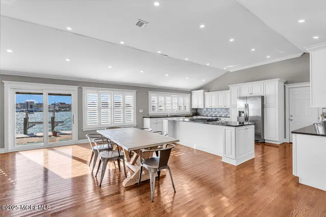 a kitchen with a table and chairs in it