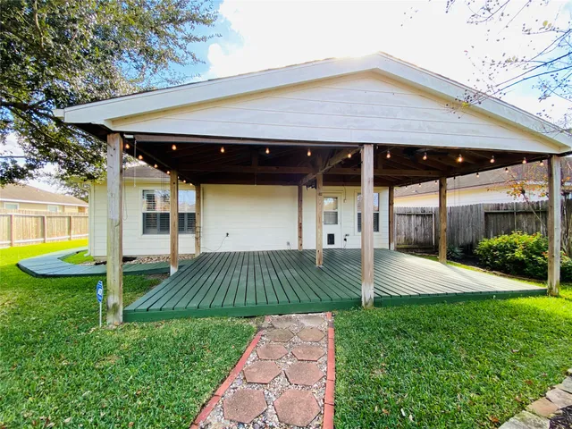 a front view of house with yard and outdoor seating