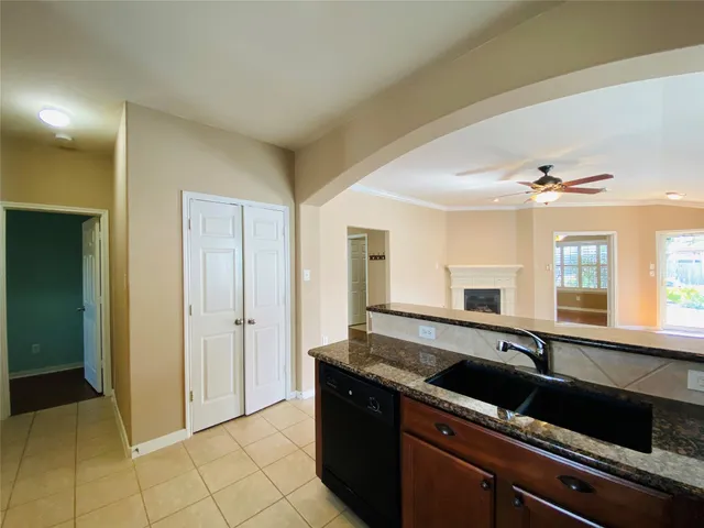 a spacious bathroom with a granite countertop sink and a mirror