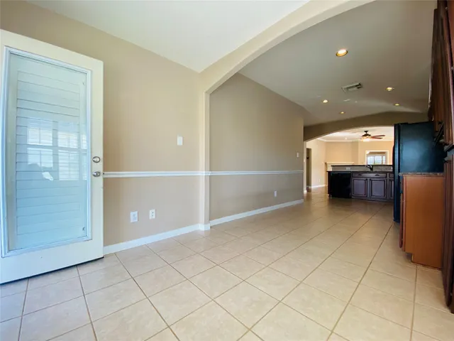a view of room with refrigerator
