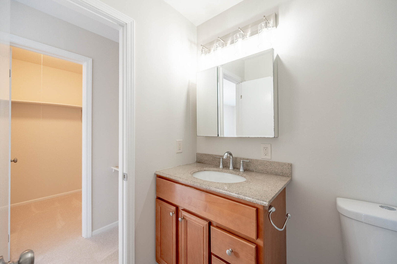 716 Inverrary Lane, Unit D Deerfield, IL 60015 - Photo 9 of 11 a bathroom with a sink and a mirror