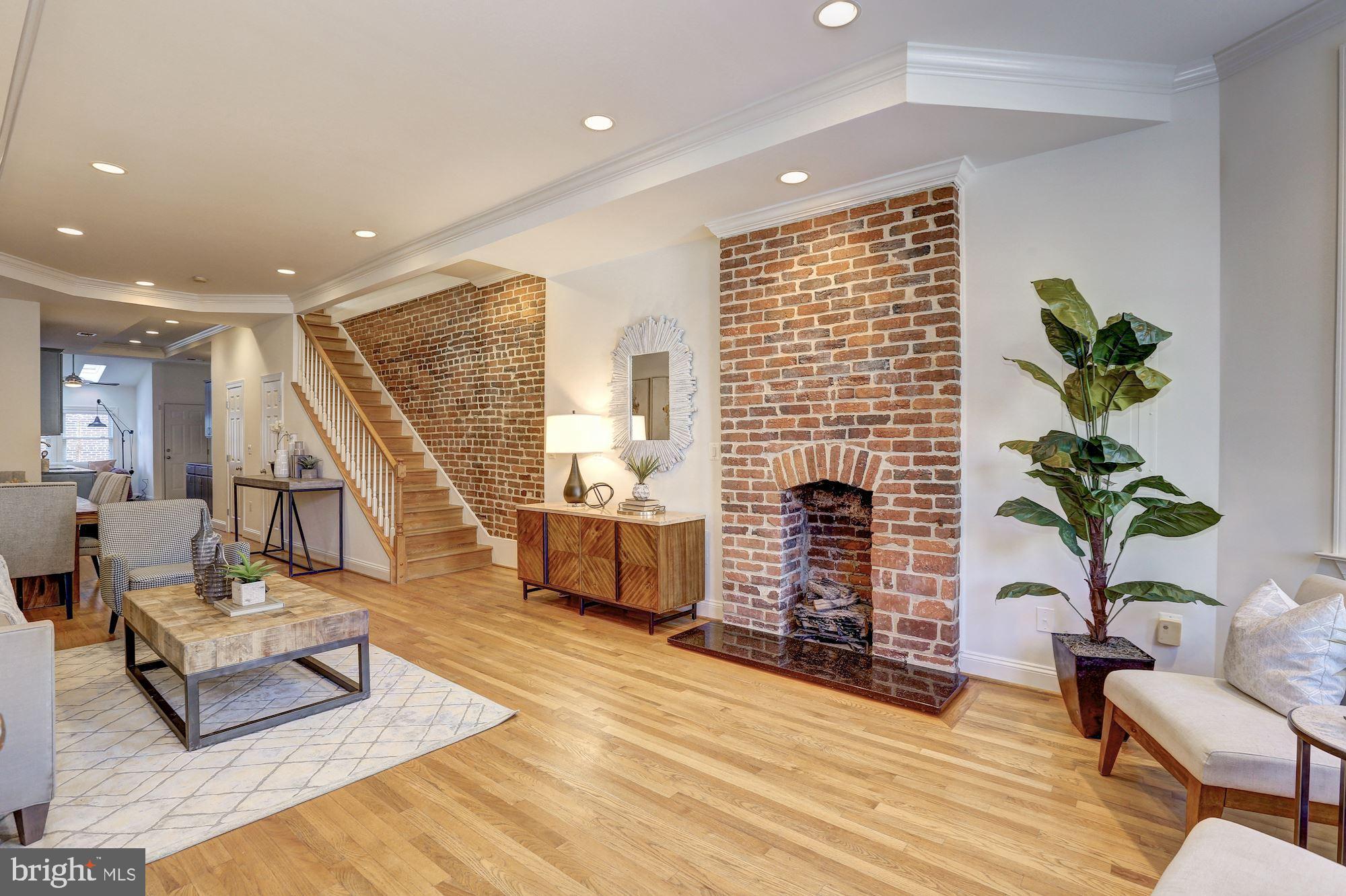2019 13th Street Northwest Washington, DC 20009 - Photo 2 of 24 Exposed brick walls and fireplace