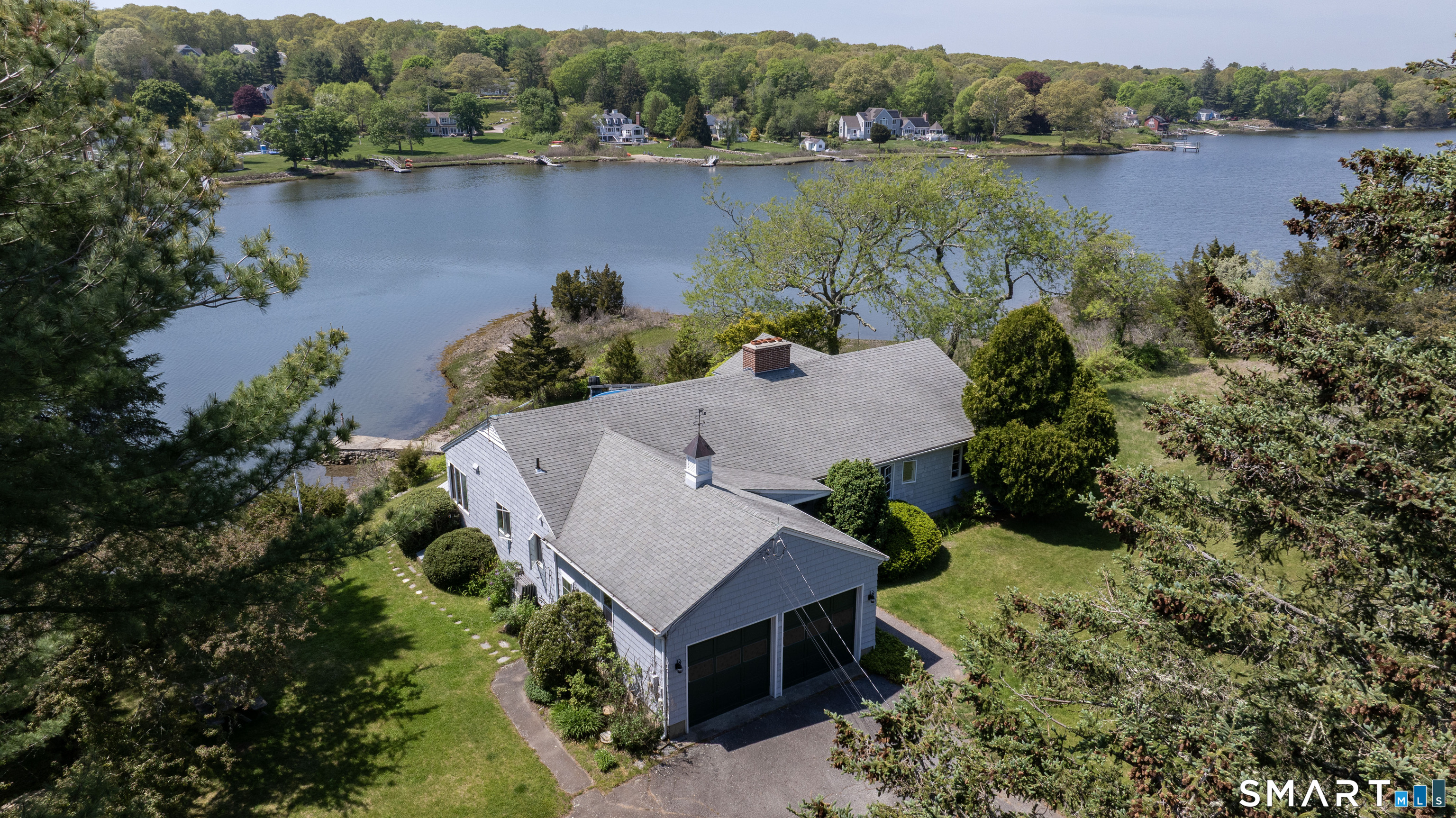 27 Wilbur Road Stonington, CT 06378 - Photo 33 of 40 an aerial view of a house with a yard and lake view