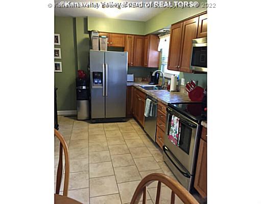 Kitchen. Stainless Steel Appliances, tile floor.