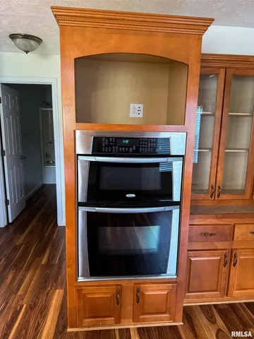 a stove top oven sitting inside of a kitchen
