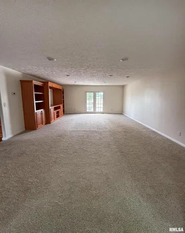 a view of empty room with windows