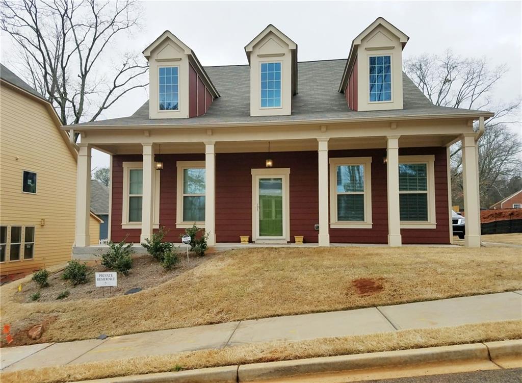2387 Tilson Forest Drive Decatur, GA 30032 - Photo 1 of 1 front view of a brick house with a rug