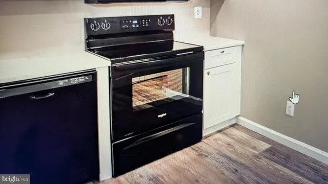 a kitchen with a stove and a microwave