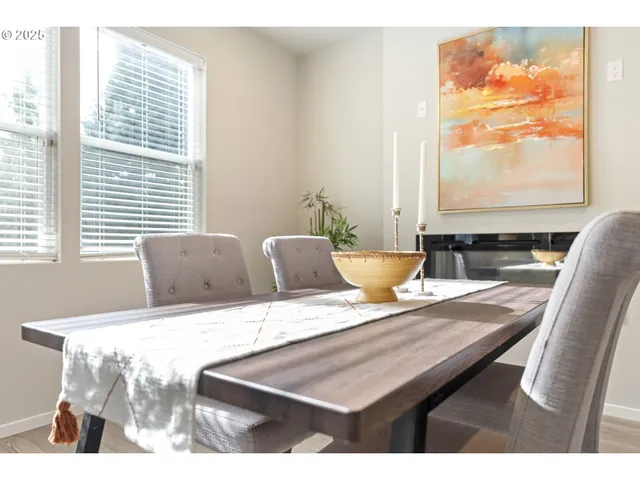 a view of a dining room with furniture and a window