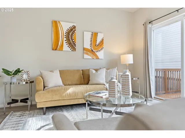 a living room with furniture and a rug