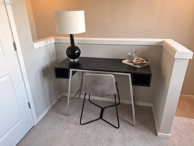 a view of a hallway with seating area