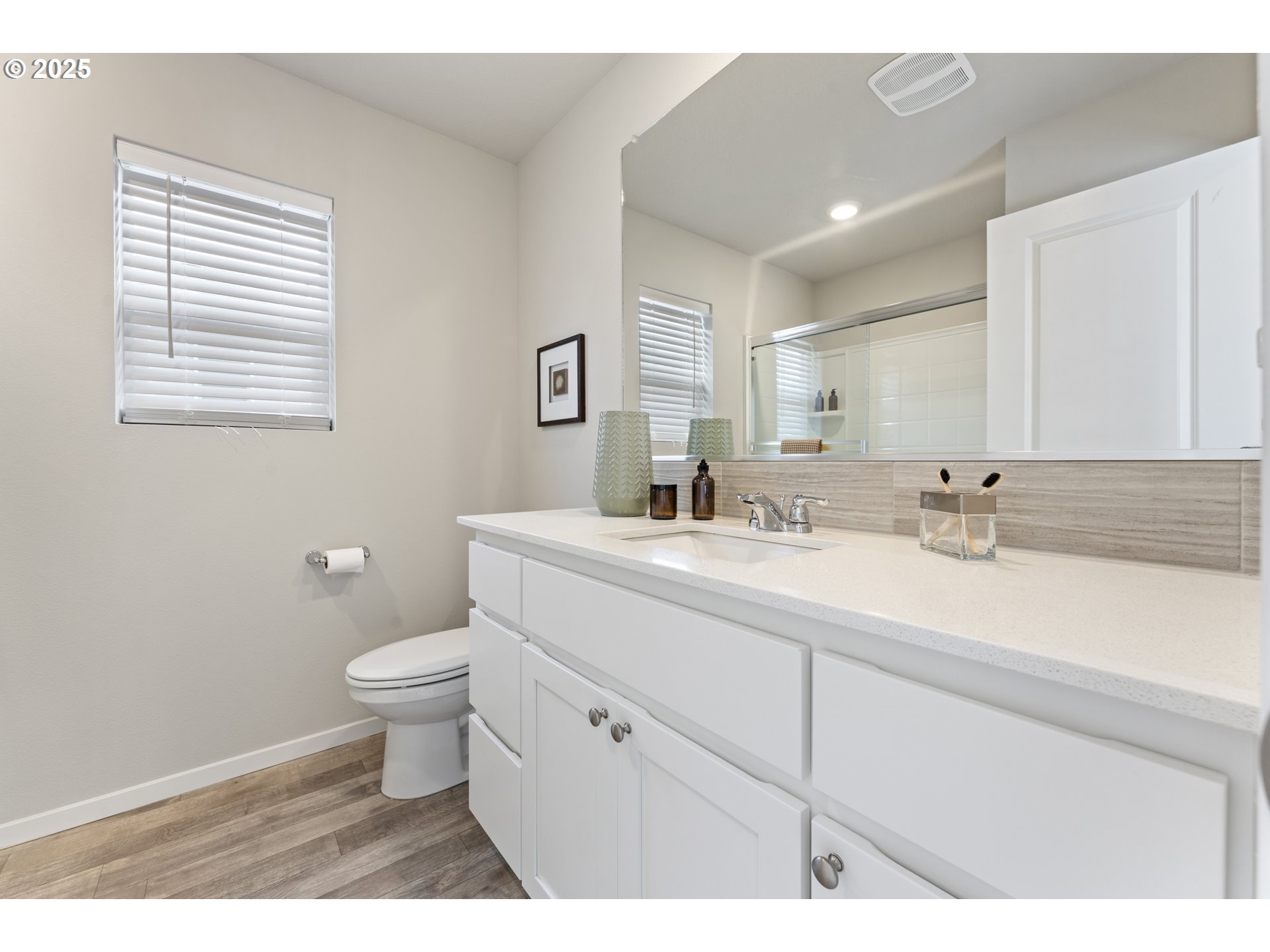 3314 Southwest 42nd Street Gresham, OR 97080 - Photo 24 of 38 a bathroom with a sink a toilet a mirror and vanity