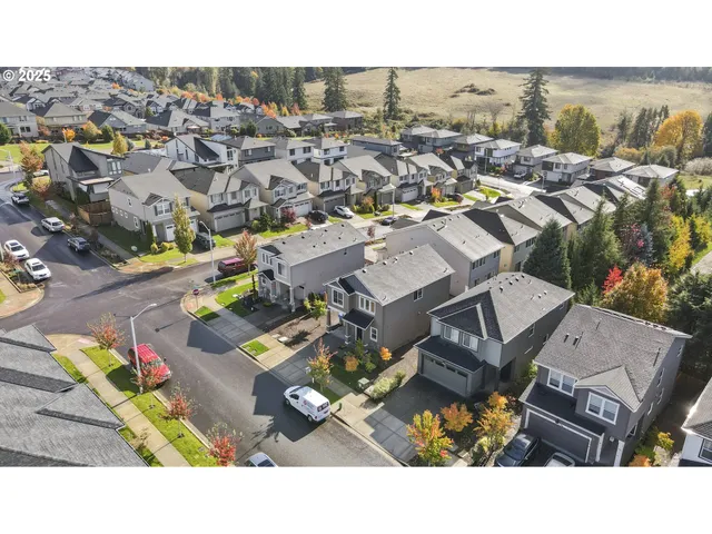 an aerial view of a house with a swimming pool