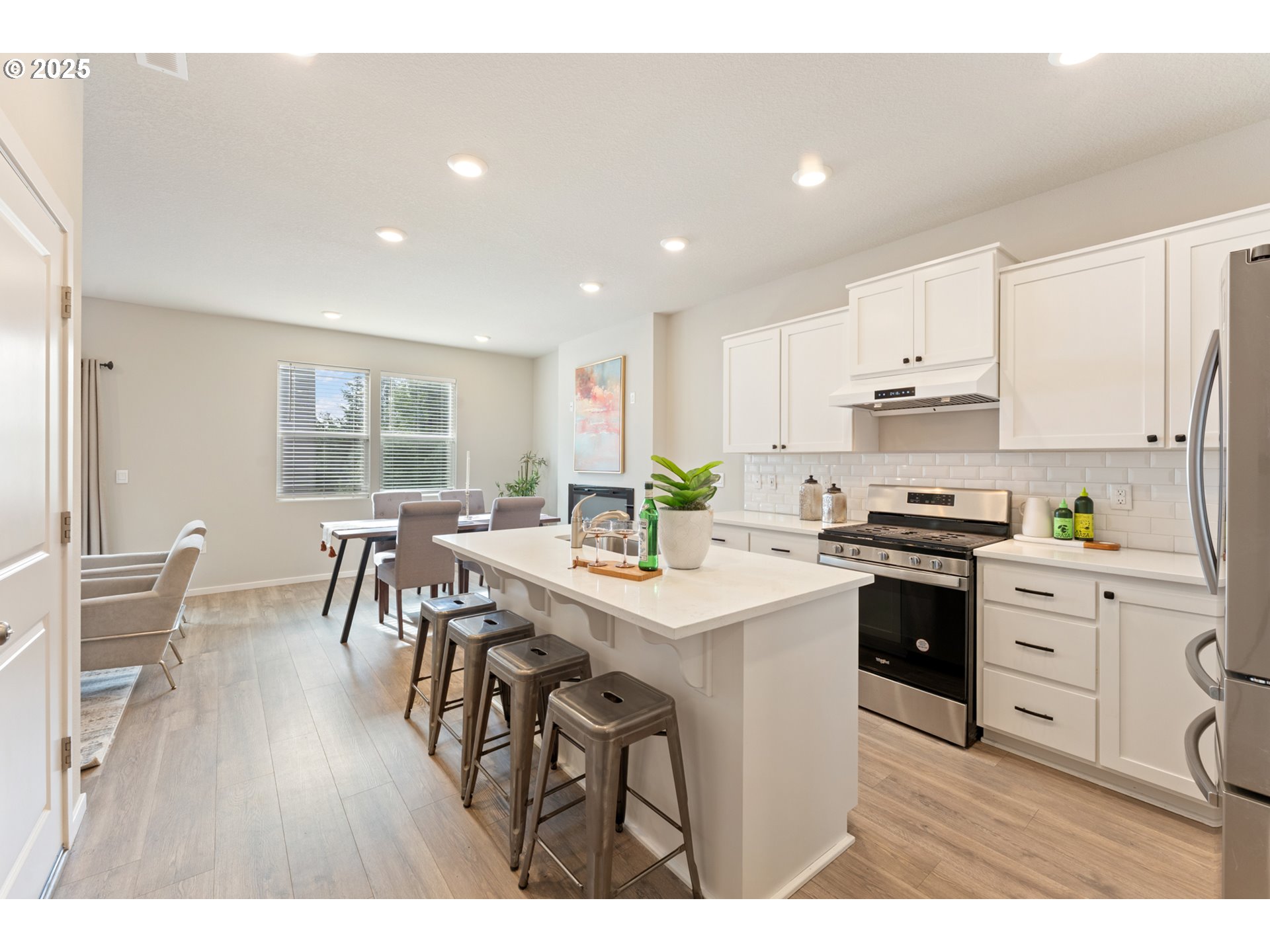 3314 Southwest 42nd Street Gresham, OR 97080 - Photo 6 of 38 a kitchen with white cabinets and white appliances