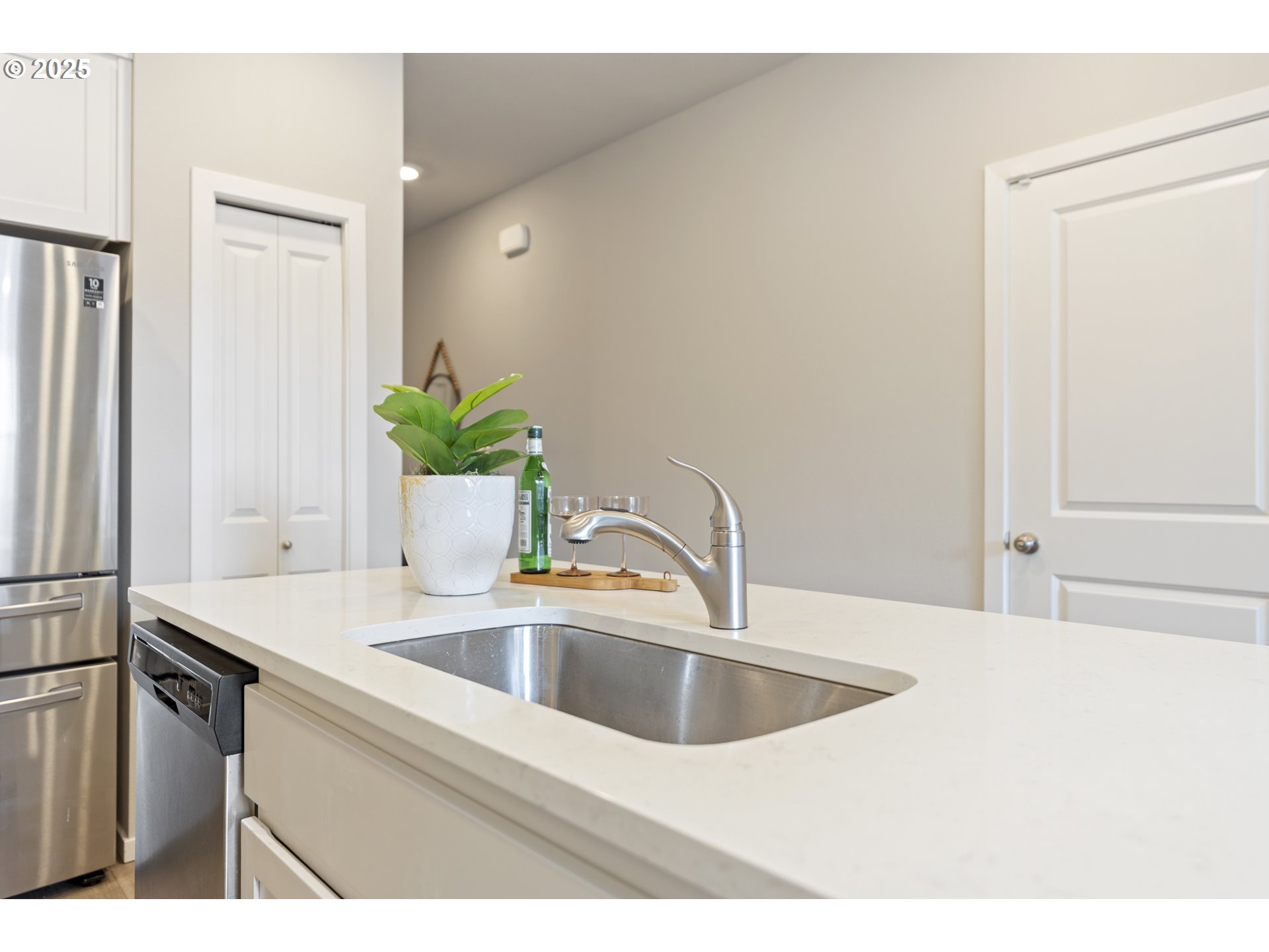 3314 Southwest 42nd Street Gresham, OR 97080 - Photo 9 of 38 a close view of a sink and dishwasher with wooden floor
