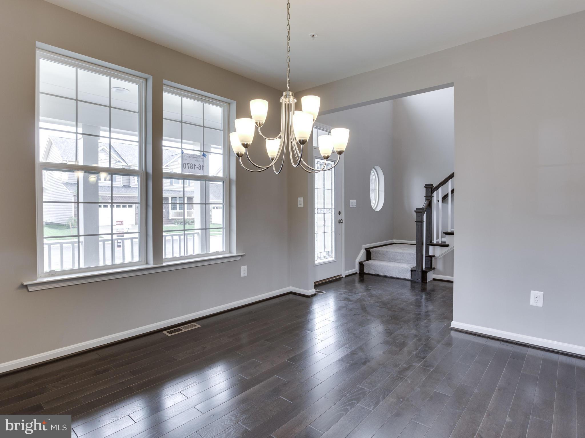 735 Holden Road Frederick, MD 21701 - Photo 5 of 30 a view of a livingroom with wooden floor and a large window