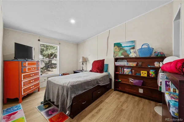 a bedroom with a bed and furniture
