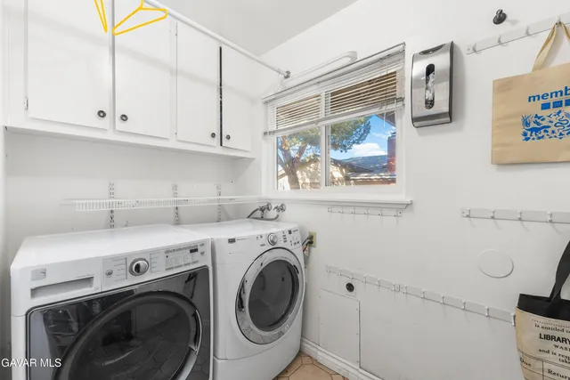 a bedroom with furniture and wooden floor