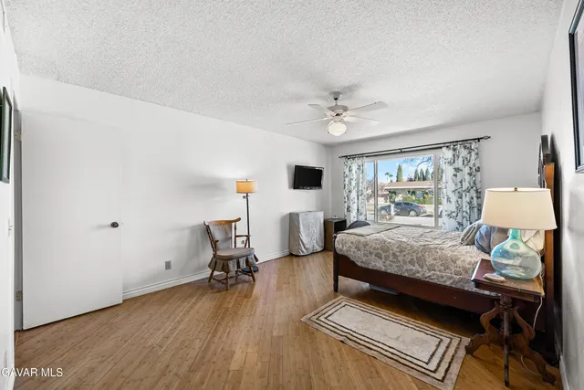 a living room with furniture and gym equipment