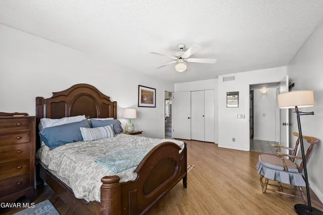a living room with a bed furniture and a window