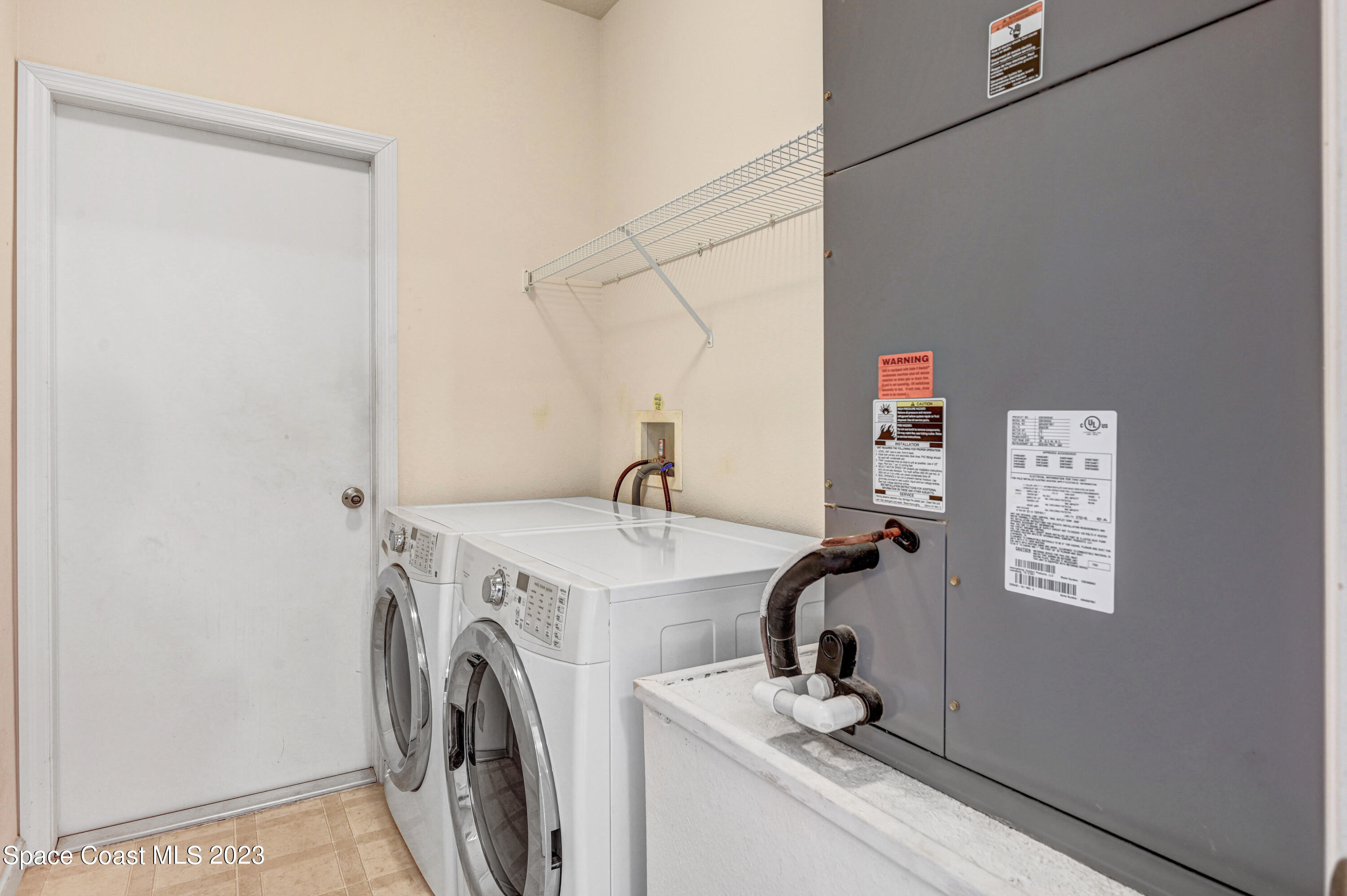 6720 Cairo Road Port St. John, FL 32927 - Photo 13 of 38 a view of room with washer and dryer