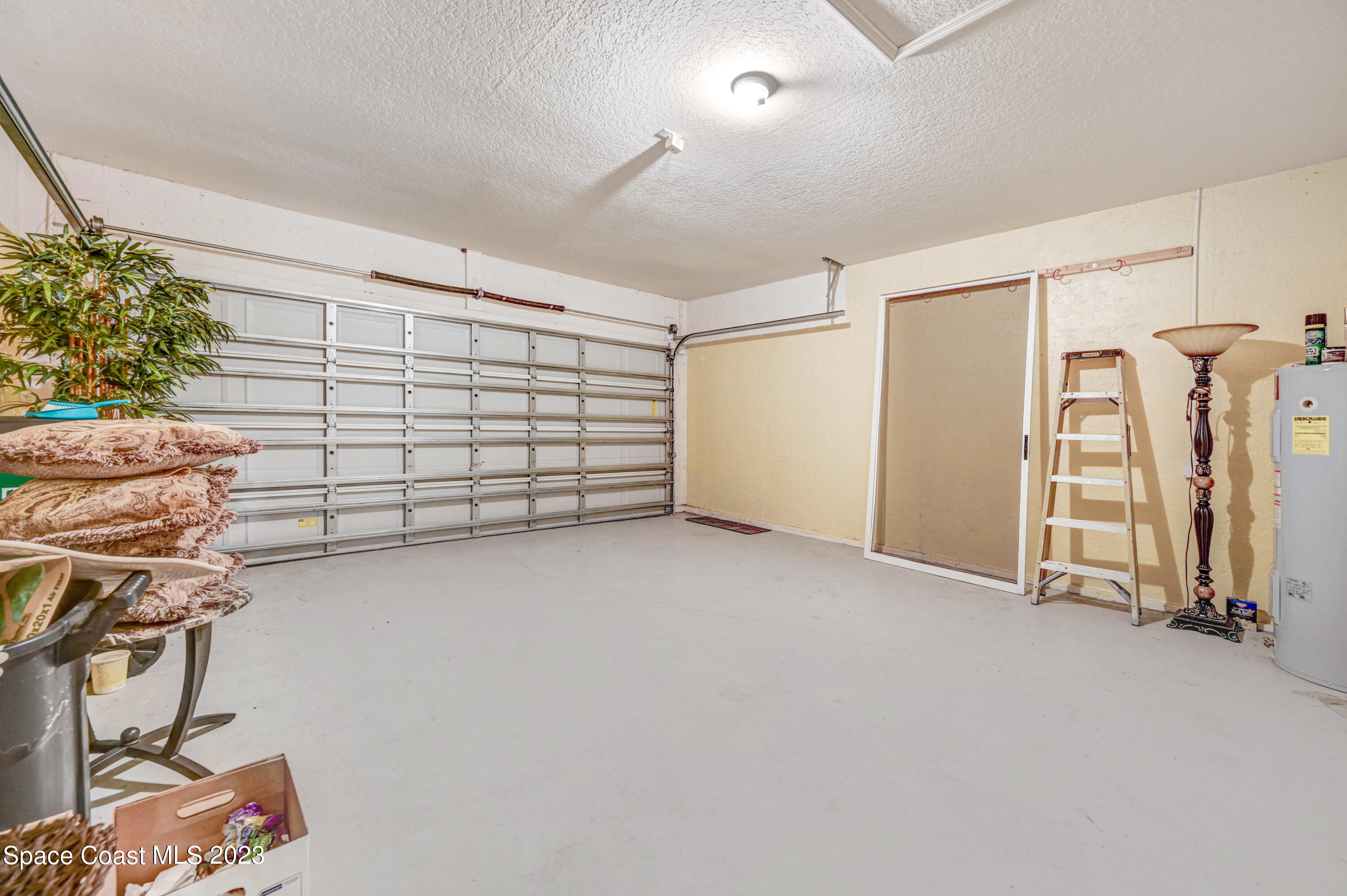 6720 Cairo Road Port St. John, FL 32927 - Photo 18 of 38 a view of a garage