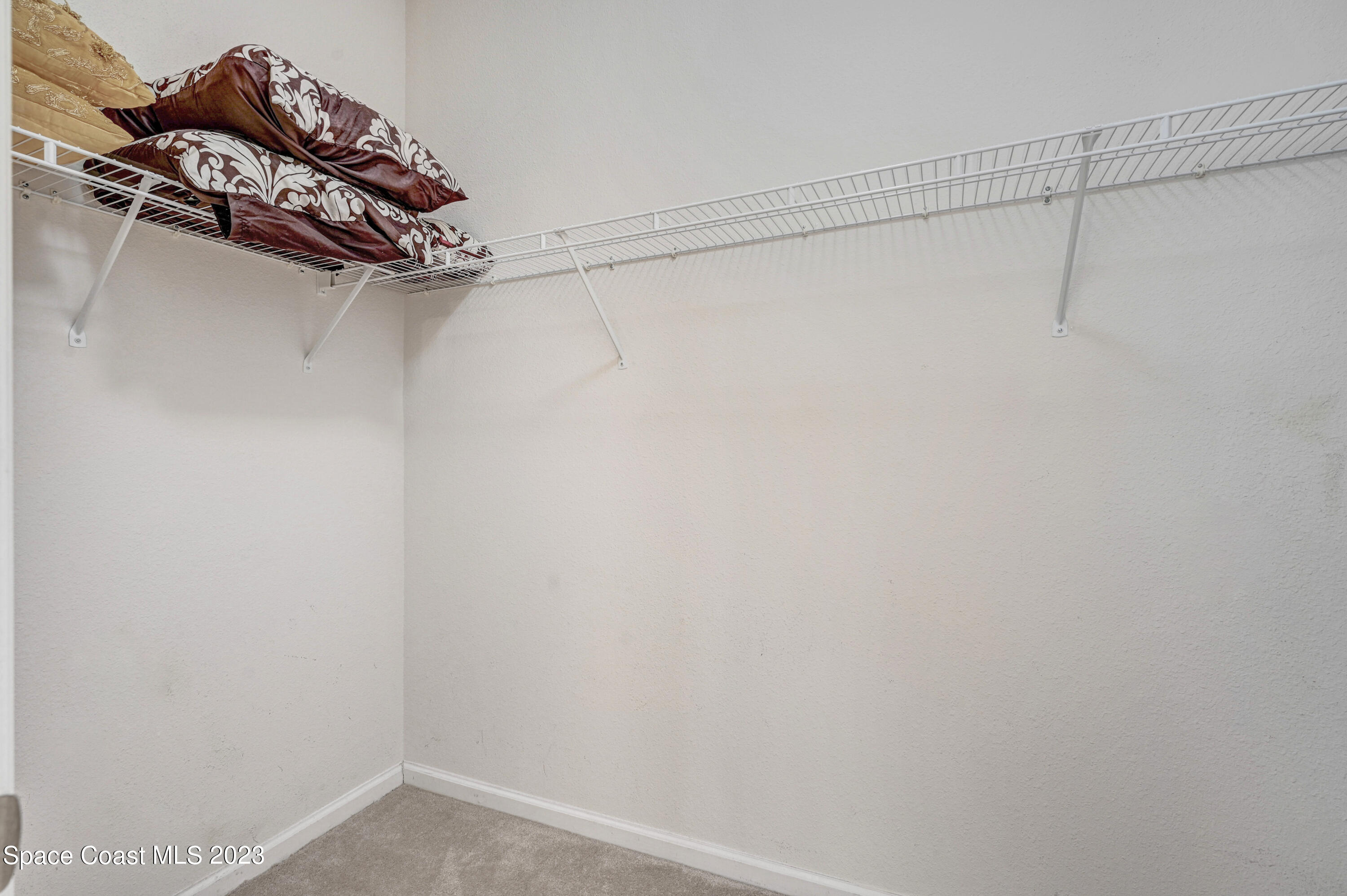 6720 Cairo Road Port St. John, FL 32927 - Photo 20 of 38 a view of a room with racks on the wall