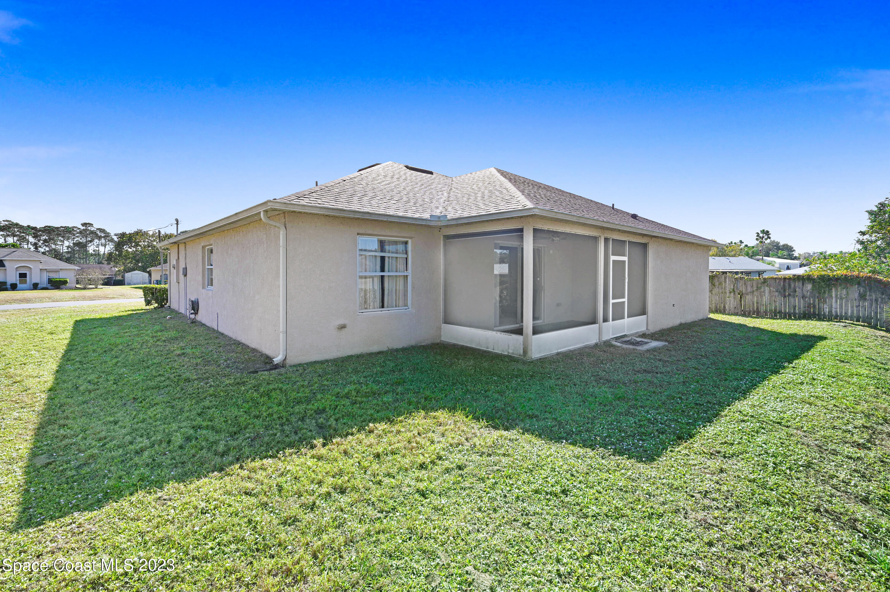 6720 Cairo Road Port St. John, FL 32927 - Photo 2 of 38 a view of a house with a yard