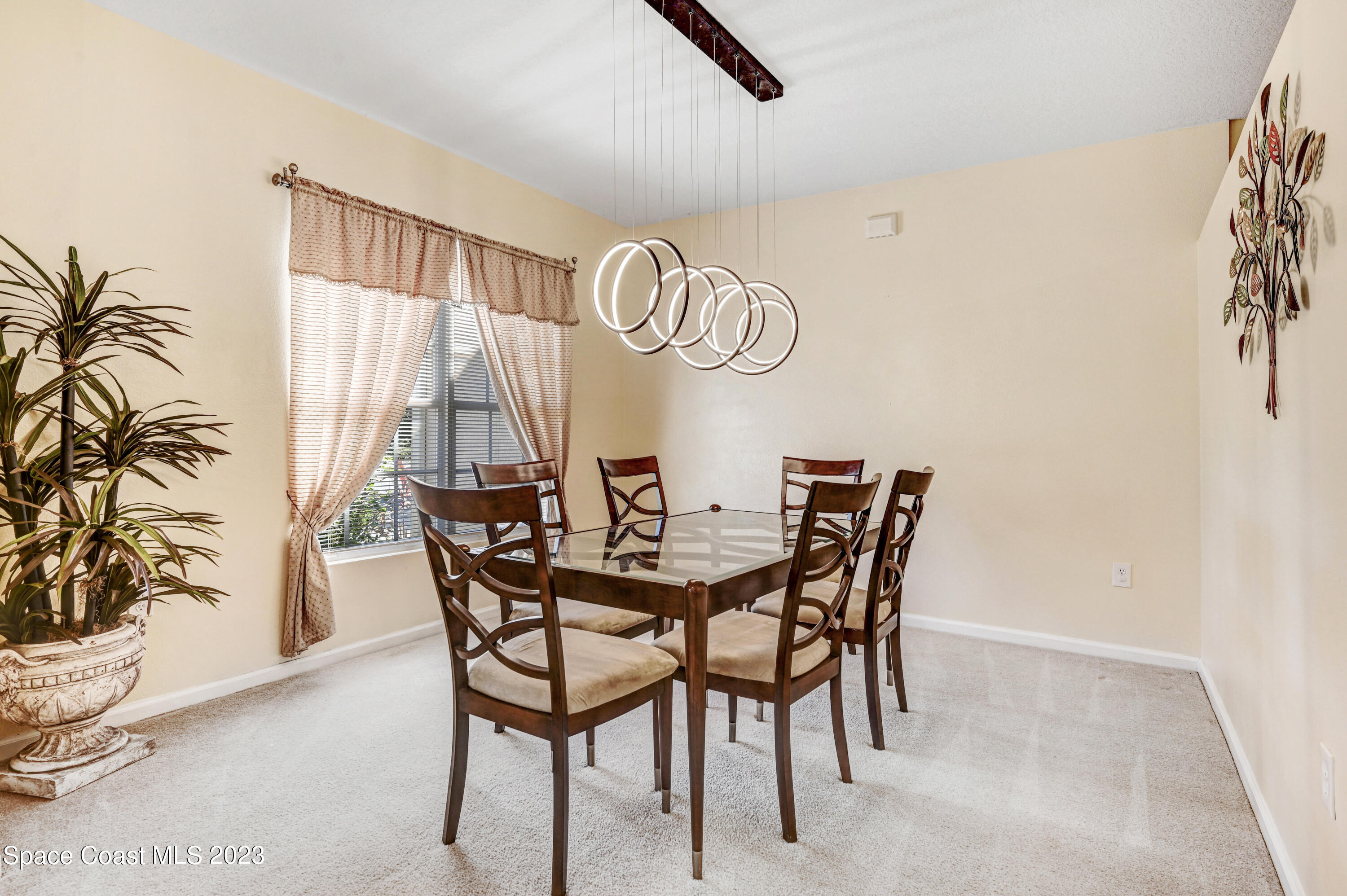 6720 Cairo Road Port St. John, FL 32927 - Photo 24 of 38 a dining room with furniture and window