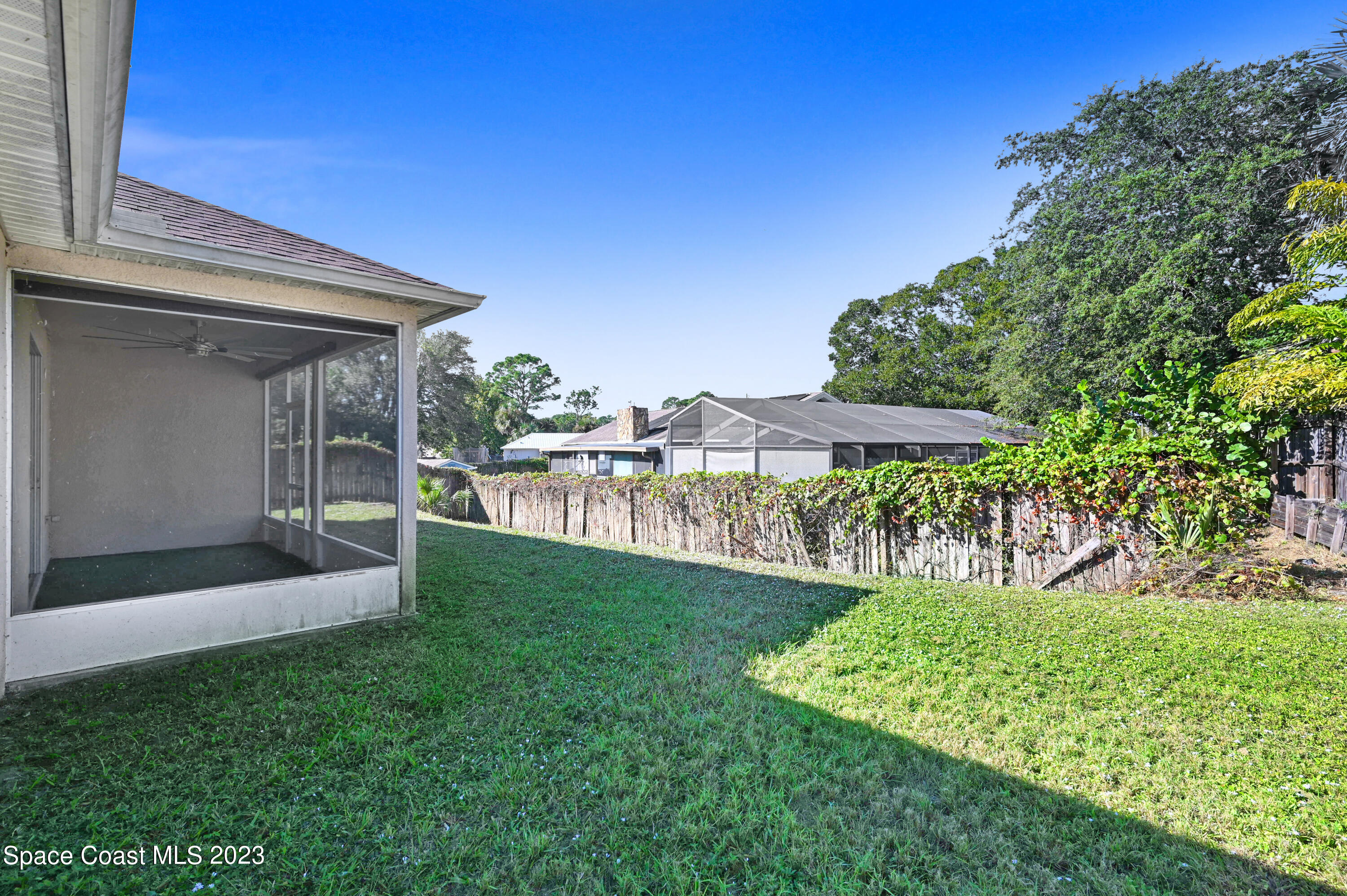 6720 Cairo Road Port St. John, FL 32927 - Photo 36 of 38 a view of a house with a yard