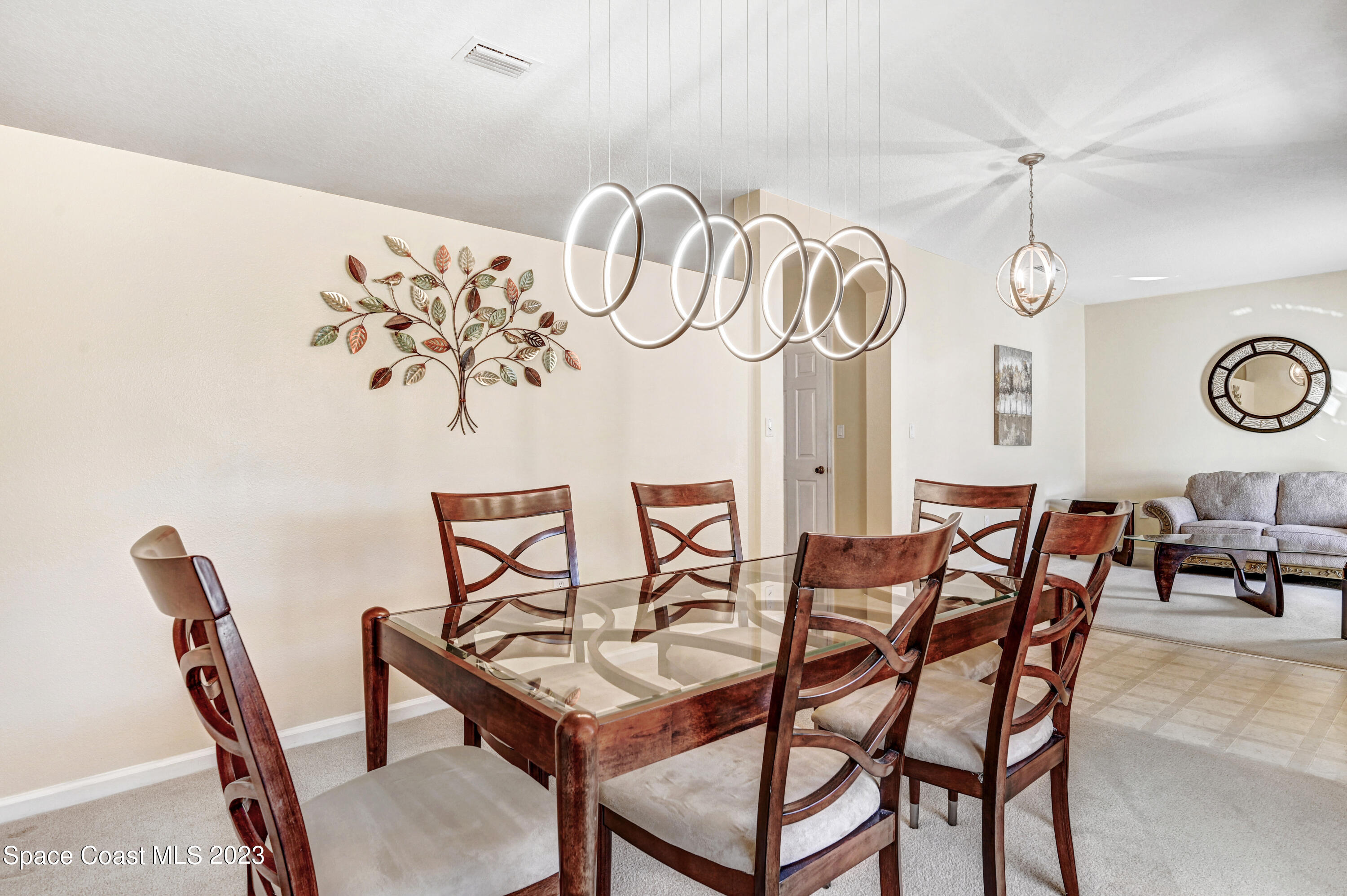 6720 Cairo Road Port St. John, FL 32927 - Photo 4 of 38 a view of a table and chairs in a room