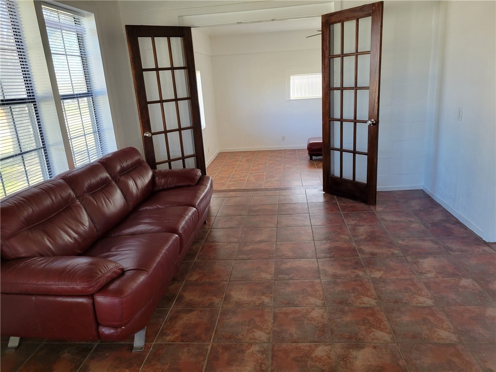 415 8th Street Bandera, TX 78003 - Photo 3 of 13 a living room with furniture and a window